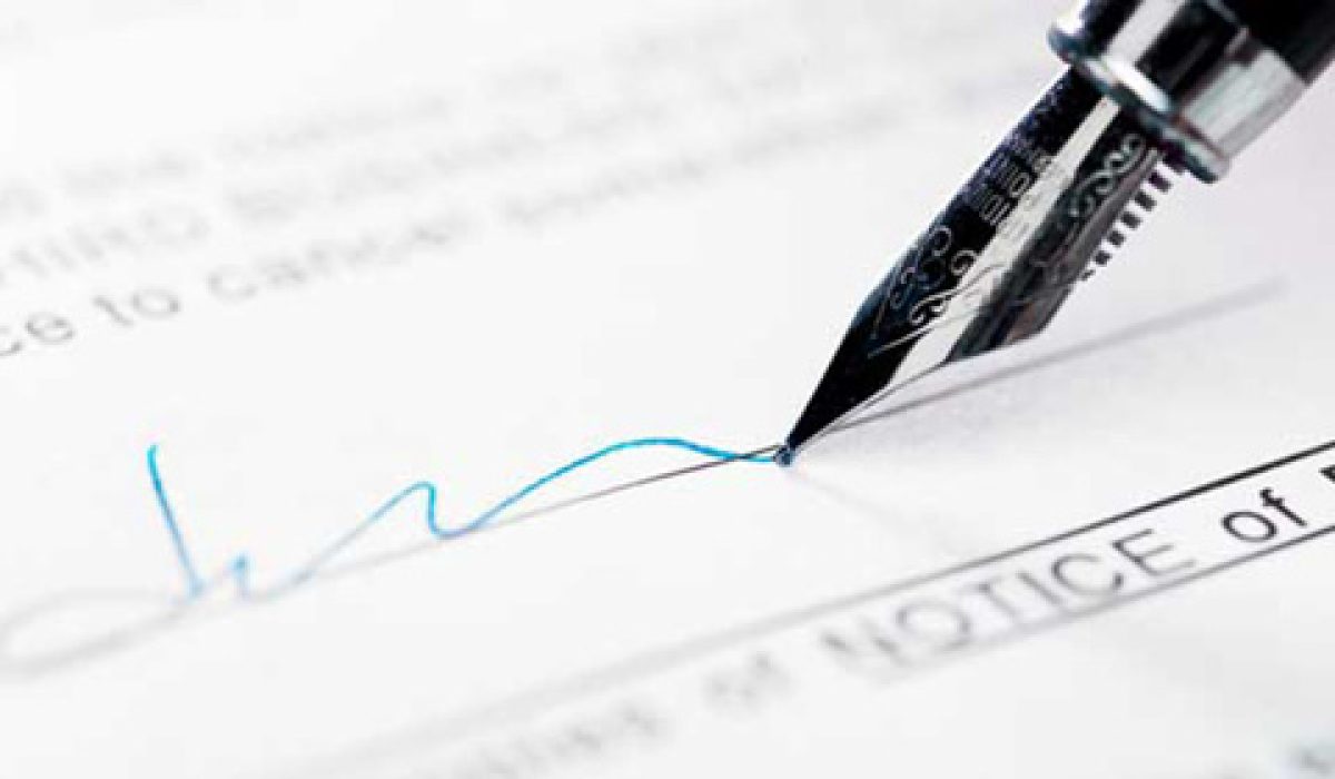 Man signing document, close-up